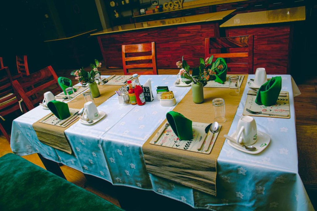 Table setting with floral placemats at Home Bliss