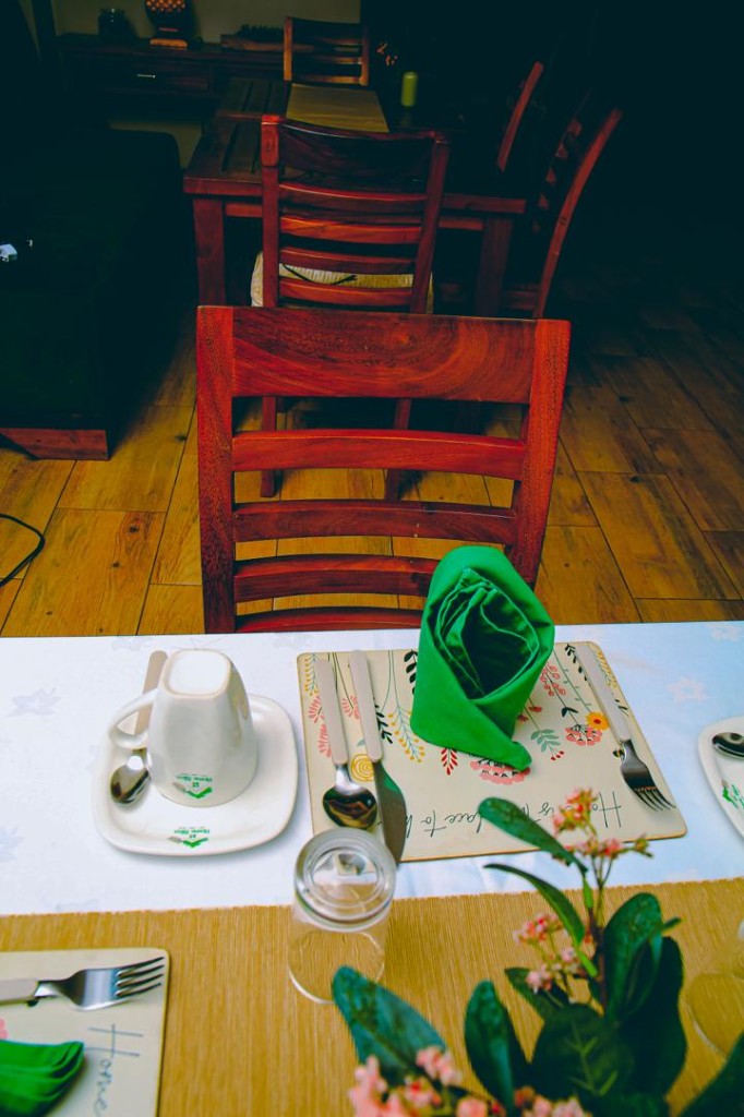 Branded cup and saucer on a floral placemat